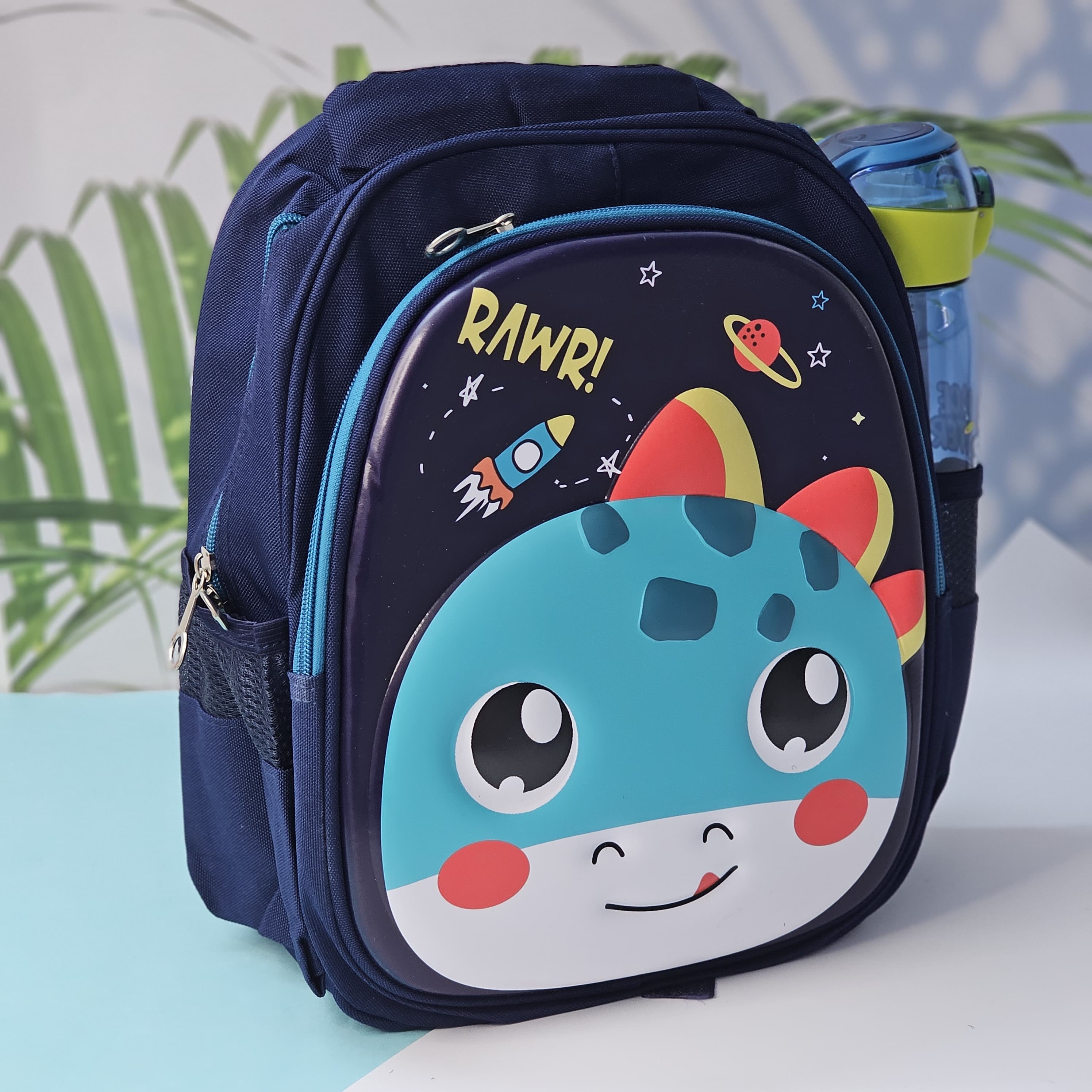 "Close-up of a Usmile Toys children's cartoon school backpack, designed in pink with a playful unicorn character on the front panel, and a matching pink water bottle in the side mesh pocket."